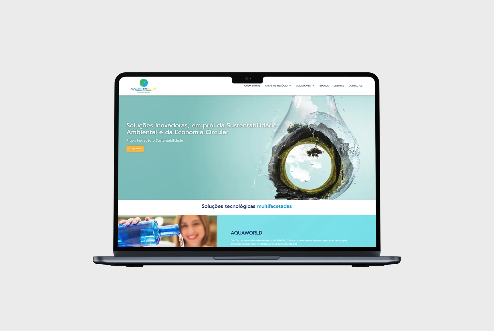 Website responsivo da Ecozero Biofactor em laptop, mostrando soluções ambientais e economia circular